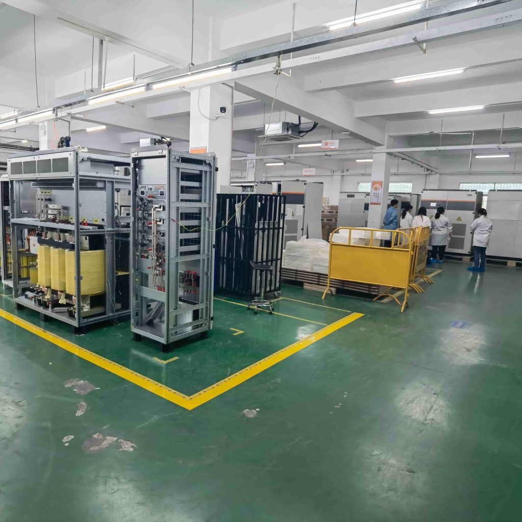 Engineers at the MegSolid manufacturing facility inspecting commercial and industrial solid-state energy storage cabinets.