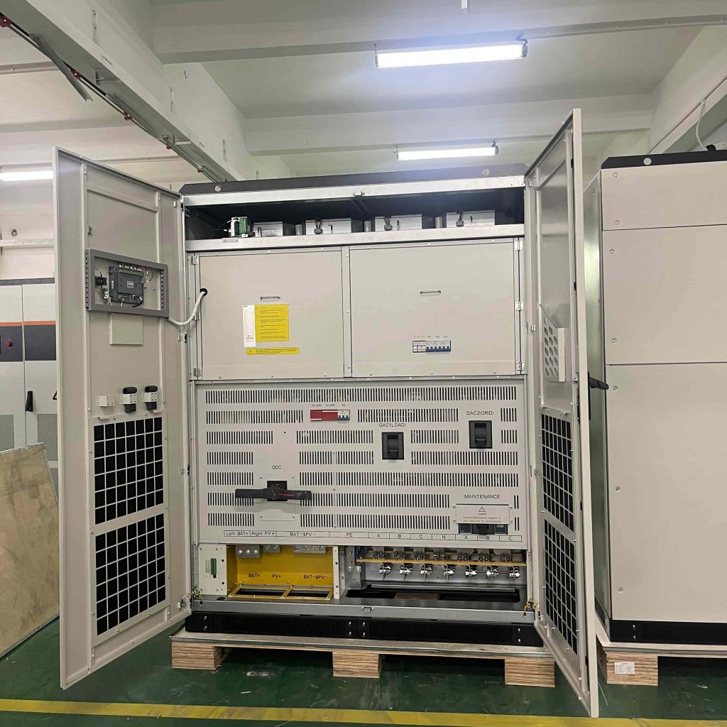 Internal wiring and breaker layout of a MegSolid hybrid commercial energy storage cabinet on the factory floor.